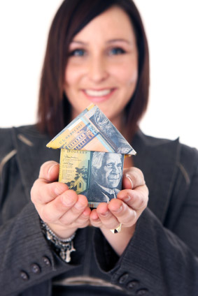 women holding money house